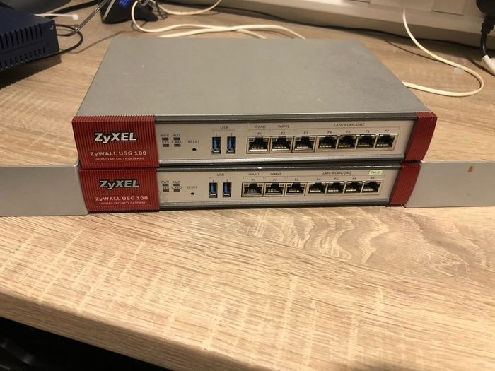 Two ZyXel USG 100 Router/ unified security gateway