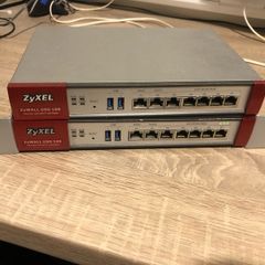 Two ZyXel USG 100 Router/ unified security gateway