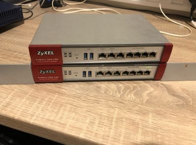 Two ZyXel USG 100 Router/ unified security gateway