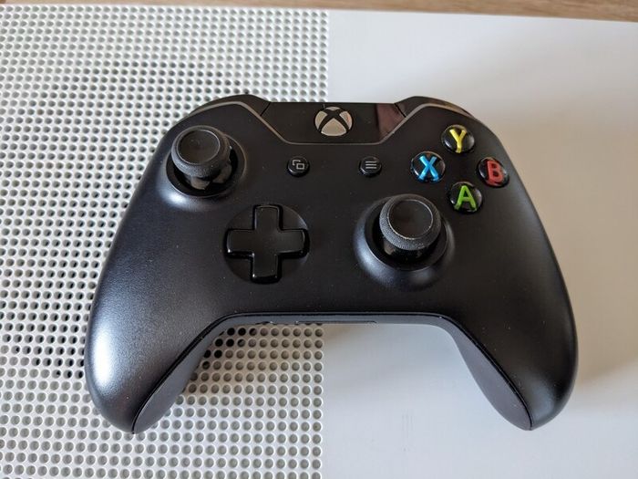 Xbox One S 1TB with controller and cables.