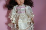Porcelain Doll on a Stand