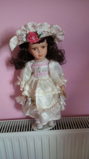 Porcelain Doll on a Stand