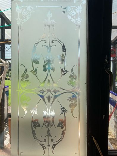 Acid etched glass panel