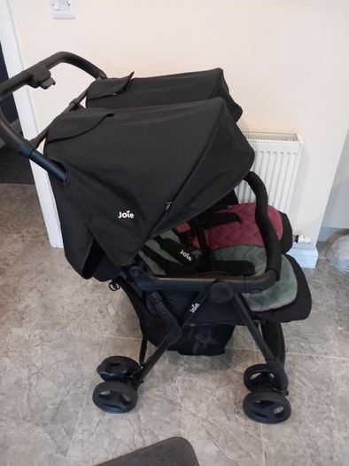 Joie double baby's buggie with rain covers