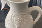Vintage 7 inch ceramic pitcher with embossed decoration