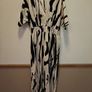Monochrome animal print V-neck jumpsuit featuring batwing sleeves and a wide-leg cut pant leg size UK 12 Image 4