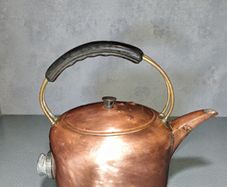 Massive copper kettle with bakelite handle
