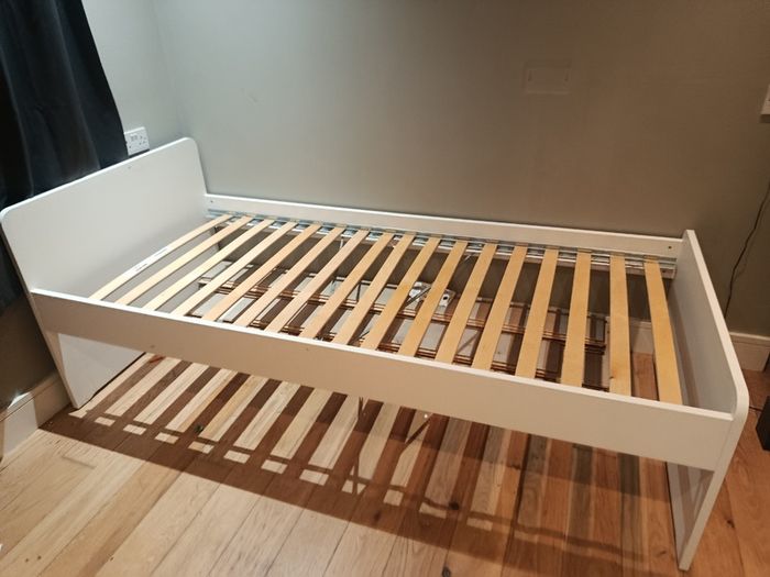 White single bed frame with slatted base