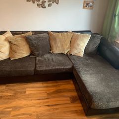 brown leather L-sofa and single armchair