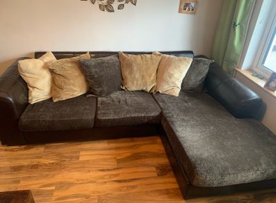 brown leather L-sofa and single armchair