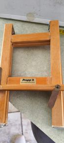 Propp it foldable wooden book holder.