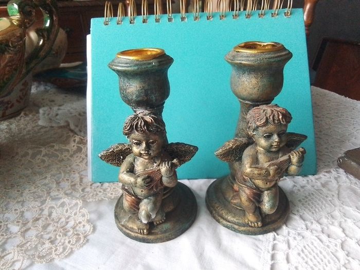 Two Churub Candlesticks