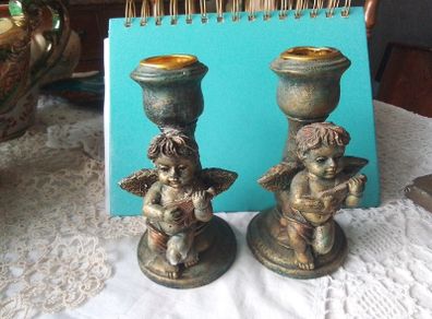 Two Churub Candlesticks