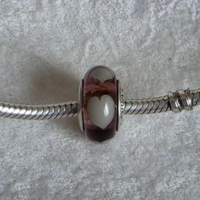 Pandora violet/purple murano glass charm with grey/Wlwhite hearts very good condition