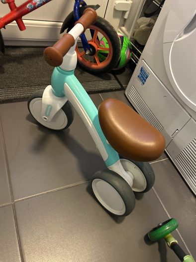 Two toddler bikes and a balance bike