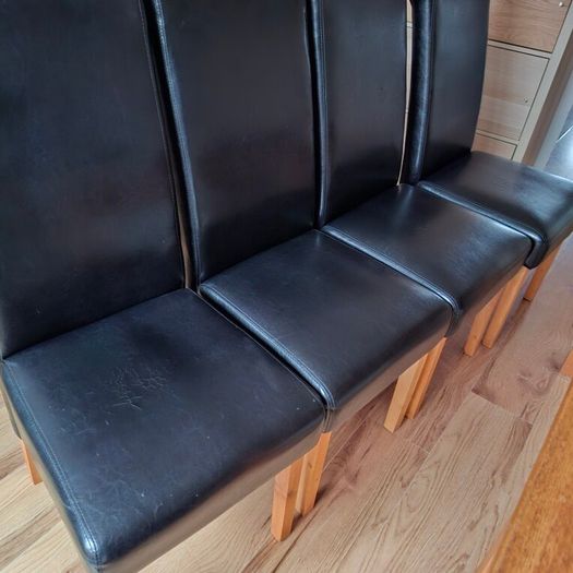 4 Black leather style kitchen chairs. Very few scuff marks 80