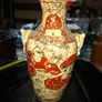 Japanese Satsuma vase featuring intricate hand painted designs of figures and patterns.  This type of earthenware pottery often dates to the Meiji period late 19th century or early 20th century Image 3