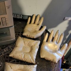 Concrete candle holder in the shape of a hand