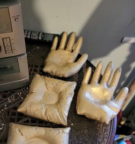 Concrete candle holder in the shape of a hand
