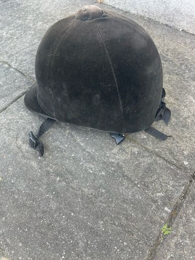 Childs horse riding helmet, boots and whip