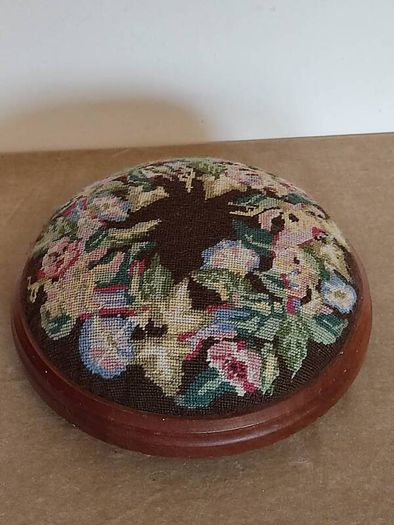 Vintage hand embroidered floral design on wooden base stool,