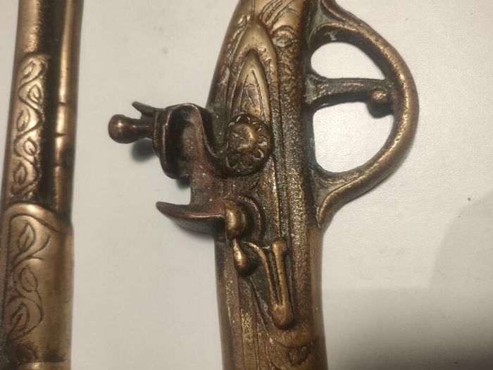 A pair of Early 20th Century 13" Brass Flintlock pistols