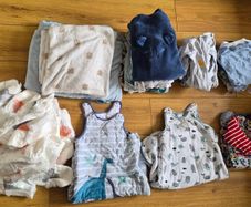 Baby boy clothes, nappies and sleep sacks