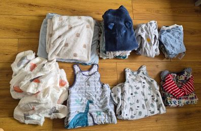 Baby boy clothes, nappies and sleep sacks