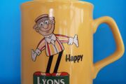 collectable Lyons tea mug and lyons memobrilia