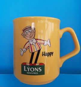 collectable Lyons tea mug and lyons memobrilia