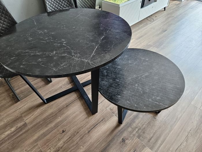 Round dining table with a matching coffee table