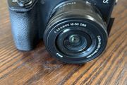 Sony Alpha a6500 mirrorless camera with the Sony 16 50mm f/3.5 5.6 OSS power and zoom kit lens.