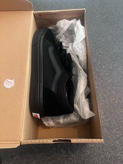 Brand new black Vans in the box