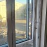 Large white bifold pvc door ,grey wrap on outside Image 10