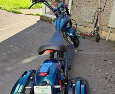 Fully Electric Chopper/Harley looks like a motorbike with matching side boxes