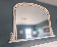 Decorative arched mirror with white and gold frame
