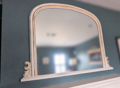 Decorative arched mirror with white and gold frame