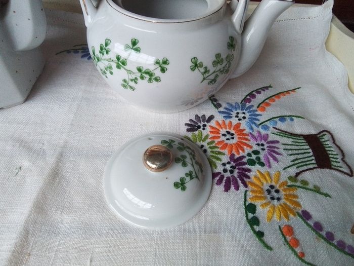 Two Wicker Handled Teapots
