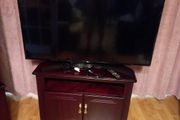 LG flat sheet TV and display cabinet