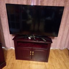 LG flat sheet TV and display cabinet