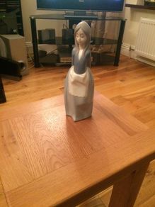Llandro Girl in blue and white apron