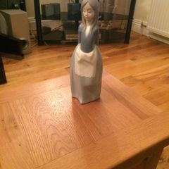 Llandro Girl in blue and white apron