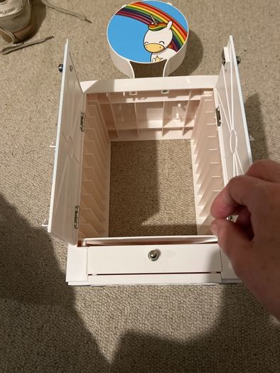 Gaming locker to hold headsets, remote controllers, up to 10 games, with drawer for cables etc