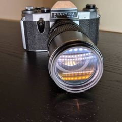 PRAKTICA PL Noval Film Camera with 80 - 200mm HANIMEX lens and camera bag.