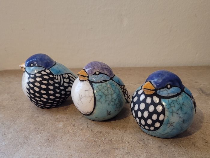 Mid-century trio of handpainted ceramic birds