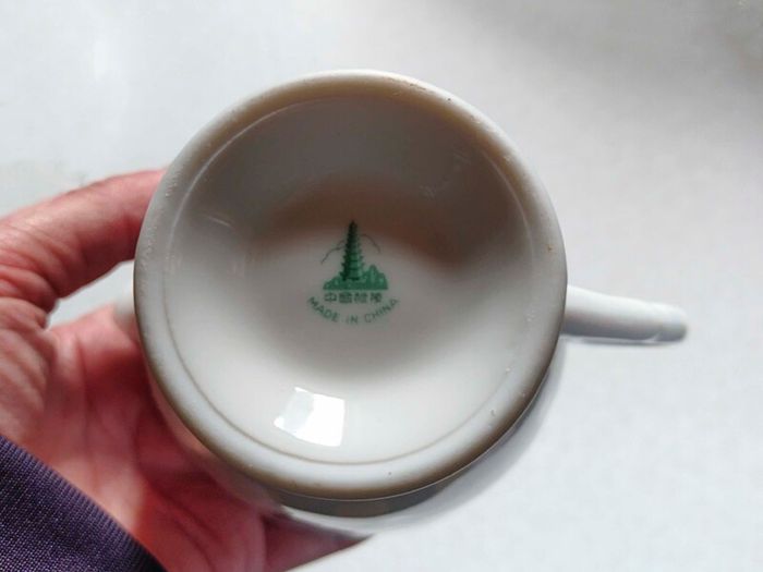 Milk Jug & 4 Saucers (used).