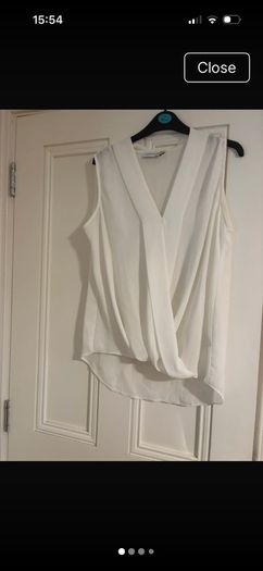 Paraphrase dressy sleeveless top, states size 14 but more like 16