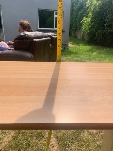 Adjustable height table for the infirm