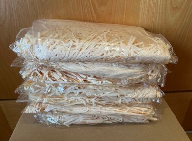 Cream coloured shredded paper