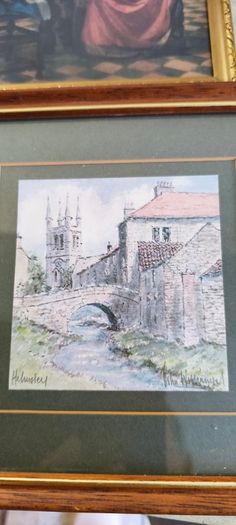 2 framed art work- 1- Vermeer's The Glass of Wine Fine Art Print -  Classic Wall Decor . 25.00euro.2- Helmsley Yorksire Colin Williamson Watercolour 35.00 euro.